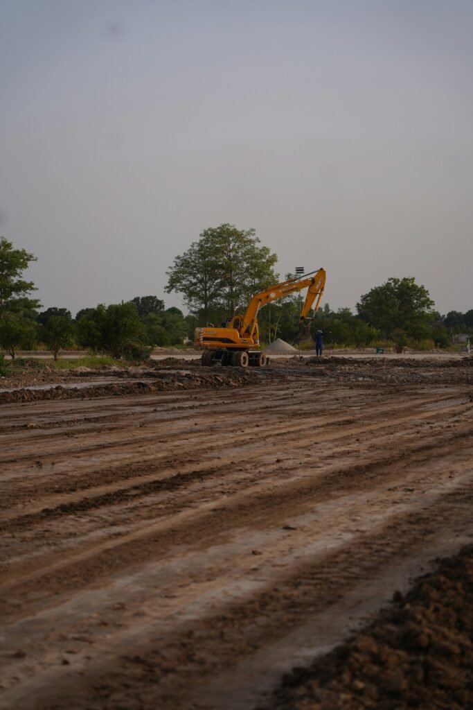 A construction professional working around heavy equipment