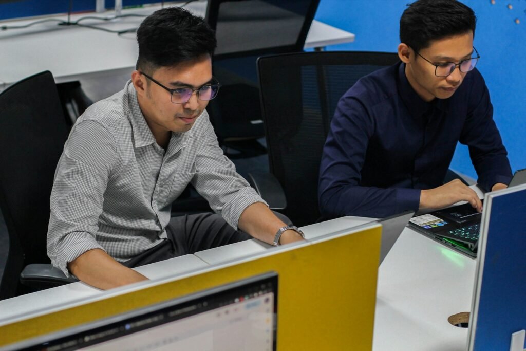 IT professionals working together at computers